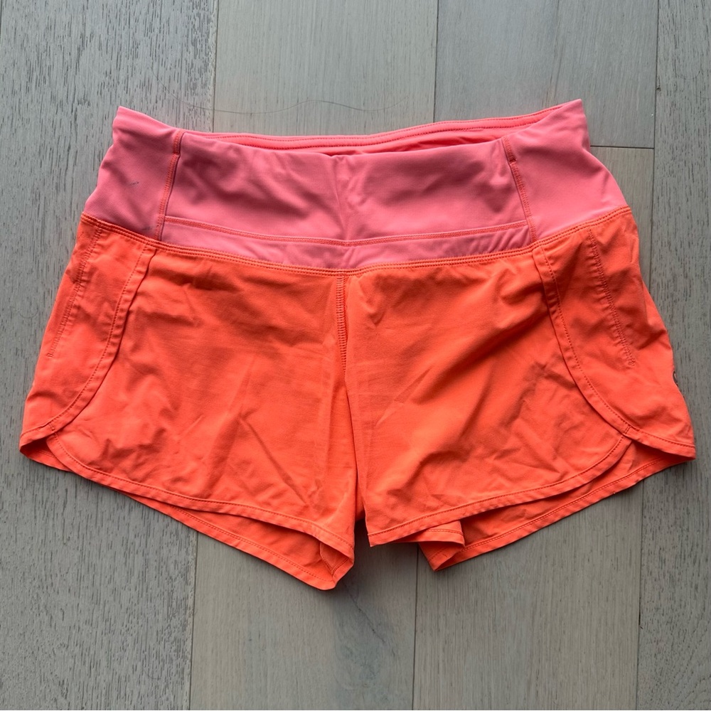 Lululemon Neon Orange Speed Up shorts, size 4
